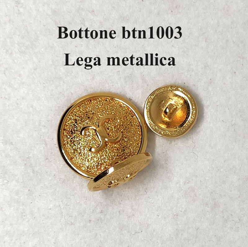 Bellissimo bottone con simbolo a rilievo